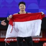 Atlet angkat besi Rahmat Erwin Abdullah mempersembahkan medali emas kedua untuk Indonesia di Asian Games 2026 (26/9)./dok.Kemenpora RI